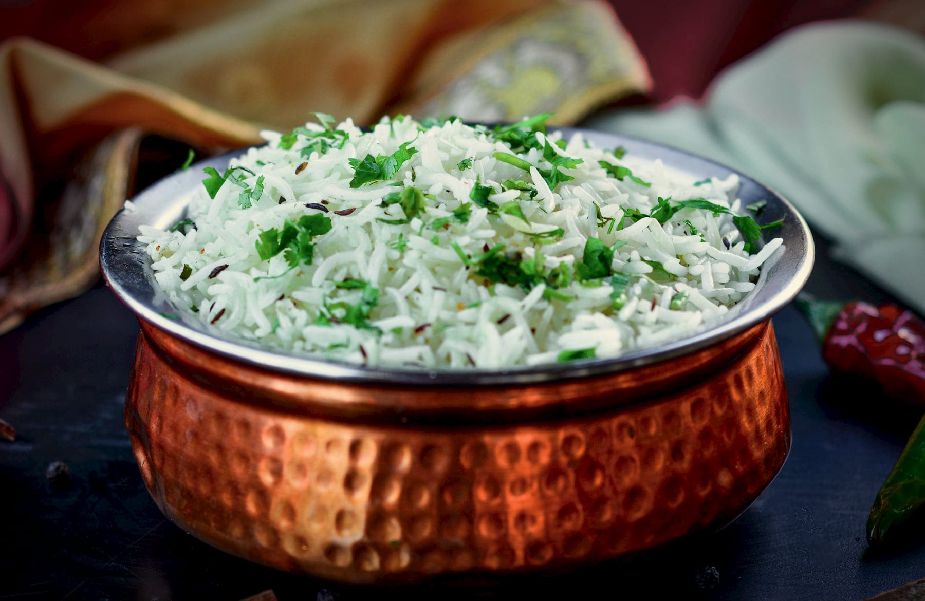 Long-grain basmati with coriander in a hammered copper handi